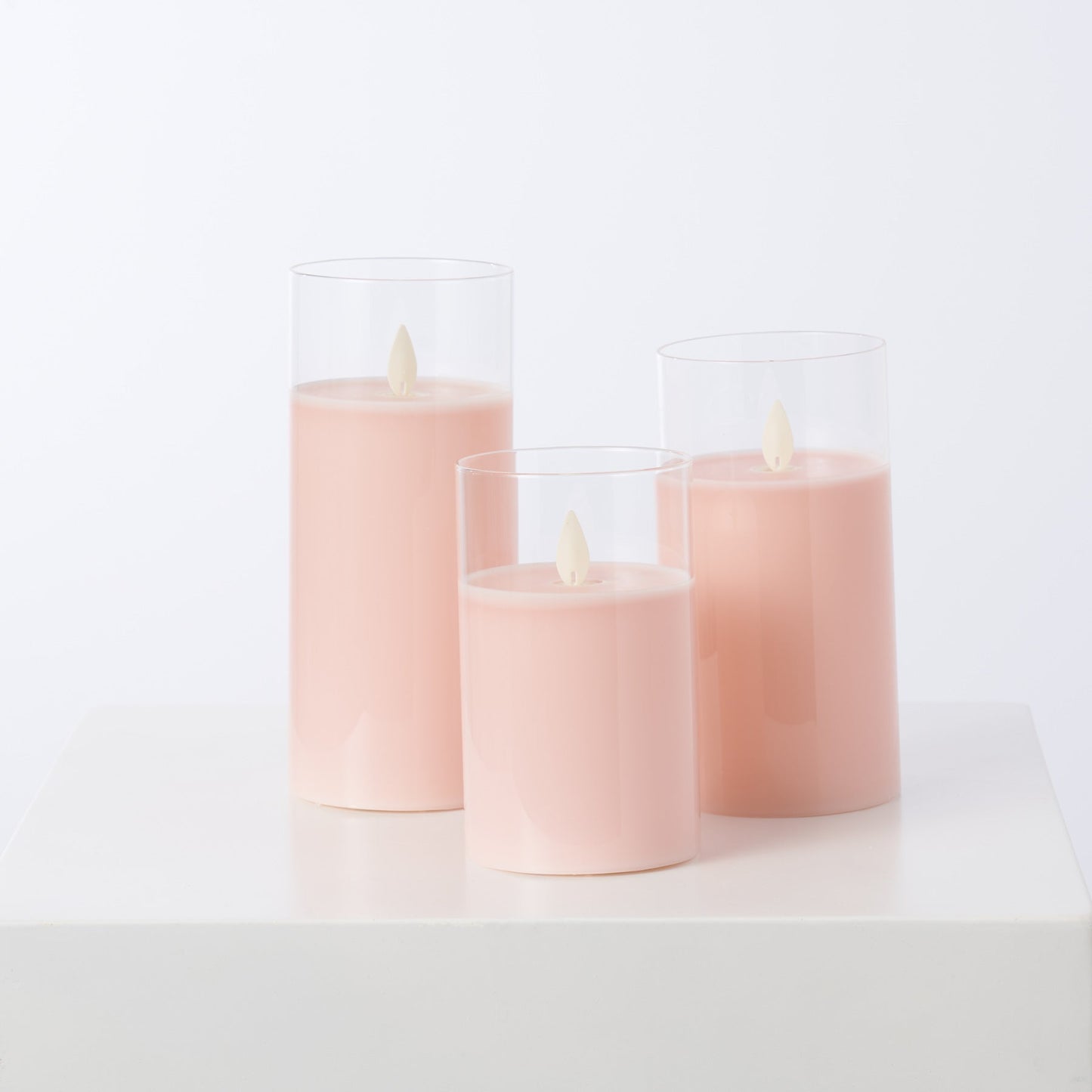 Bewegliche flammenlose LED-Pink-Glas-Säulenkerzen mit Fernbedienung - Set von 3